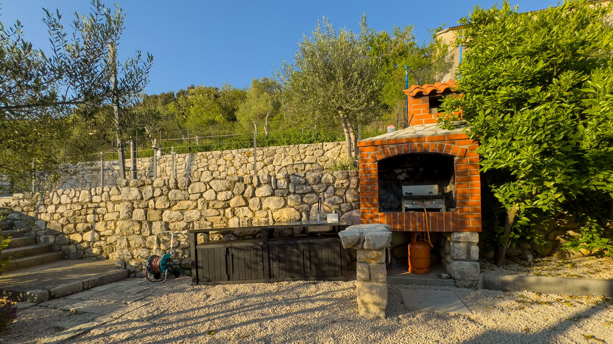 Docks Holiday Rab outdoor kitchen and brick barbecue